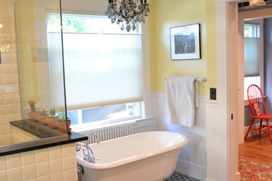 Example of a mid-sized arts and crafts master white tile and ceramic tile ceramic tile and gray floor bathroom design in Boston with recessed-panel cabinets, gray cabinets, a two-piece toilet, yellow walls, an undermount sink and black countertops