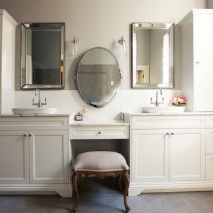 Inspiration for a mid-sized traditional 3/4 bathroom in Perth with furniture-like cabinets, white cabinets, a two-piece toilet, white tile, ceramic tile, grey walls, ceramic floors, a vessel sink, grey floor and white benchtops.
