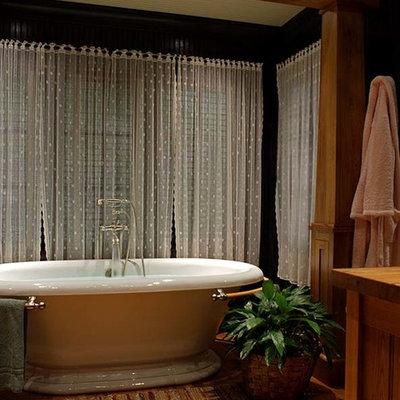 Freestanding bathtub - rustic master medium tone wood floor freestanding bathtub idea in Other