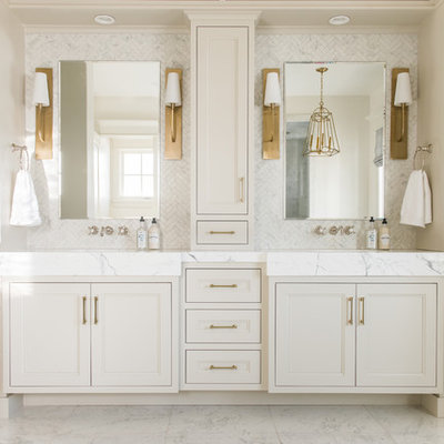 Example of a mid-sized classic master white tile and marble tile white floor and marble floor bathroom design in Salt Lake City with recessed-panel cabinets, beige cabinets, white walls, white countertops, an integrated sink and marble countertops