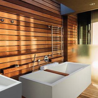 Inspiration for a large asian master bathroom in Other with a freestanding tub, medium hardwood floors and a vessel sink.