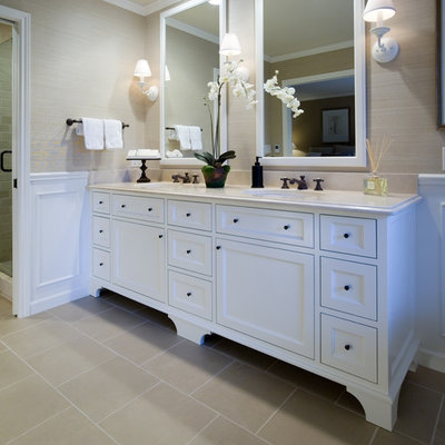 Elegant beige tile corner shower photo in Portland with recessed-panel cabinets and white cabinets