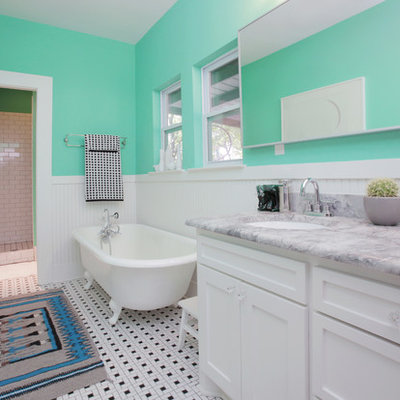 Claw-foot bathtub - eclectic multicolored floor claw-foot bathtub idea in Dallas with marble countertops