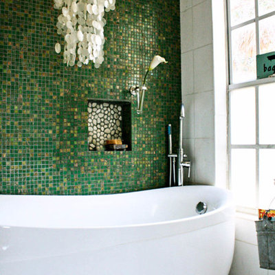 Eclectic freestanding bathtub photo in Tampa with green walls