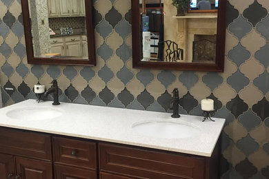 Example of a mid-sized transitional master blue tile bathroom design in New York with furniture-like cabinets, dark wood cabinets, quartzite countertops and beige walls