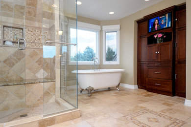 Bathroom - large traditional master stone tile travertine floor bathroom idea in Denver with recessed-panel cabinets, dark wood cabinets and beige walls