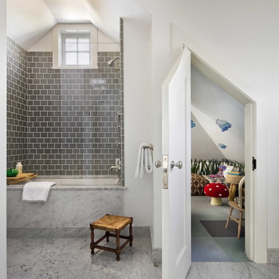 Tub/shower combo - mid-sized coastal kids' gray tile marble floor and gray floor tub/shower combo idea in Boston with an undermount tub and white walls