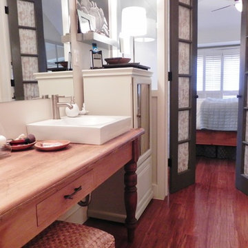 narrow bath, double sinks, antique table vanity, frosted glass, french doors