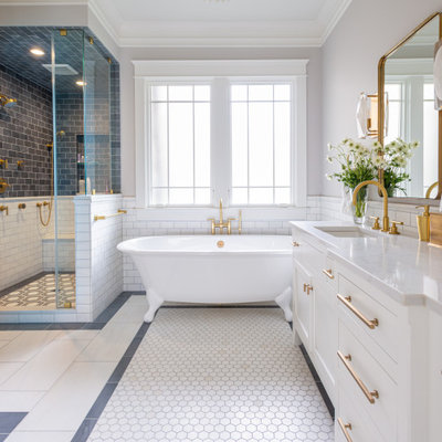 Bathroom - transitional master gray tile, white tile and subway tile mosaic tile floor and white floor bathroom idea in Nashville with shaker cabinets, white cabinets, gray walls, an undermount sink and white countertops