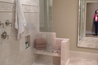 Photo of a large classic ensuite bathroom in Other with an integrated sink, white cabinets, granite worktops, a walk-in shower, beige tiles, stone tiles, beige walls and limestone flooring.