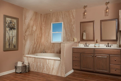 Inspiration for a mid-sized timeless ceramic tile and brown floor corner bathtub remodel in Miami with raised-panel cabinets, dark wood cabinets, brown walls, an undermount sink and solid surface countertops