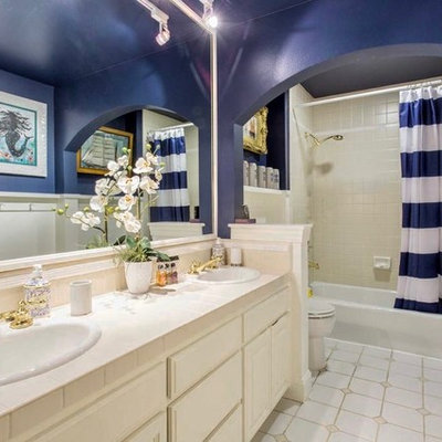 Inspiration for a mid-sized contemporary kids' porcelain tile and gray floor bathroom remodel in San Francisco with shaker cabinets, white cabinets, blue walls, a drop-in sink, tile countertops and beige countertops