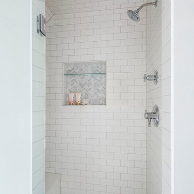Bathroom - large traditional master white tile and stone tile marble floor bathroom idea in Minneapolis with recessed-panel cabinets, white cabinets, quartz countertops, gray walls and a console sink