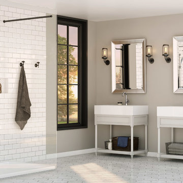 Neutral Tone His/Her Bathroom with Roman Tub and Walk in Shower.
