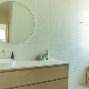Photo of a mid-sized contemporary master bathroom in Sunshine Coast with flat-panel cabinets, light wood cabinets, an open shower, ceramic tile, ceramic floors, engineered quartz benchtops, grey floor, an open shower and white benchtops.