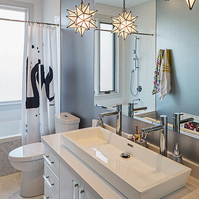 Bathroom - contemporary white tile bathroom idea in Toronto with a vessel sink, flat-panel cabinets and white cabinets