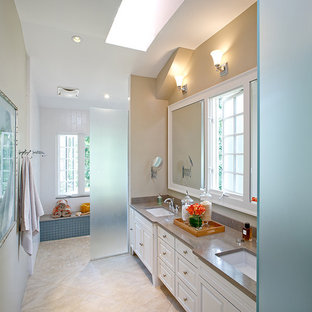 This is an example of a traditional bathroom in DC Metro with limestone benchtops and a curbless shower.