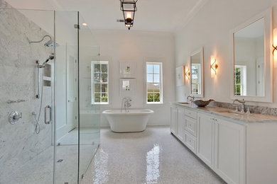 Large contemporary ensuite bathroom in New Orleans with shaker cabinets, white cabinets, a freestanding bath, a corner shower, white walls, mosaic tile flooring, a submerged sink, granite worktops, white floors and a hinged door.