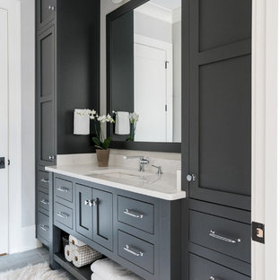 Design ideas for a mid-sized transitional master bathroom in Atlanta with shaker cabinets, an alcove shower, white tile, subway tile, grey walls, an undermount sink, engineered quartz benchtops, a hinged shower door, grey cabinets, laminate floors and grey floor.