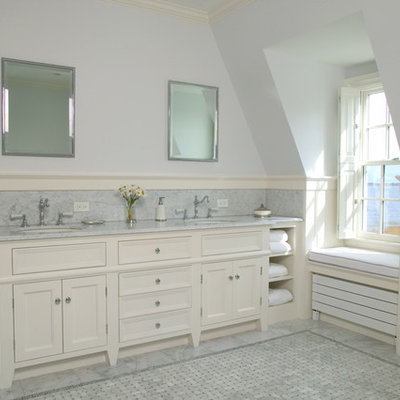 Large elegant master gray tile and marble tile mosaic tile floor and gray floor freestanding bathtub photo in Boston with an undermount sink, recessed-panel cabinets, white cabinets, blue walls, marble countertops and gray countertops