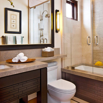 Inspiration for a contemporary beige tile bathroom remodel in Orange County with an undermount sink, open cabinets, dark wood cabinets and an undermount tub