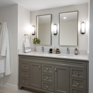 Inspiration for a mid-sized transitional bathroom in Brisbane with shaker cabinets, grey cabinets, white walls, porcelain floors, an undermount sink, grey floor, white benchtops, a double vanity and a built-in vanity.