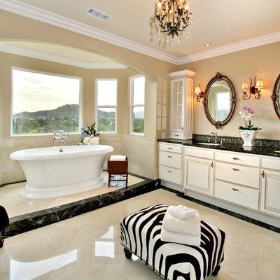 Freestanding bathtub - contemporary marble floor freestanding bathtub idea in San Diego