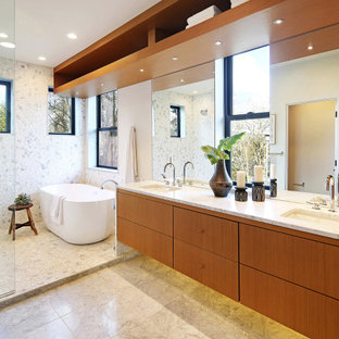 Wet room - mid-sized scandinavian master multicolored tile multicolored floor and single-sink wet room idea in Seattle with flat-panel cabinets, brown cabinets, a one-piece toilet, white walls, a drop-in sink, white countertops and a floating vanity