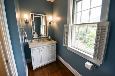 Elegant bathroom photo in Other with an undermount sink and recessed-panel cabinets