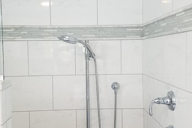 Inspiration for a mid-sized timeless master white tile and porcelain tile porcelain tile and gray floor alcove shower remodel in Bridgeport with shaker cabinets, white cabinets, a two-piece toilet, blue walls, an undermount sink, marble countertops and a hinged shower door