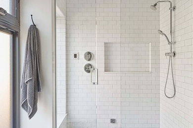 Example of a mid-sized transitional master white tile and ceramic tile mosaic tile floor and black floor walk-in shower design in Chicago with furniture-like cabinets, medium tone wood cabinets, a two-piece toilet, white walls, an undermount sink and a hinged shower door
