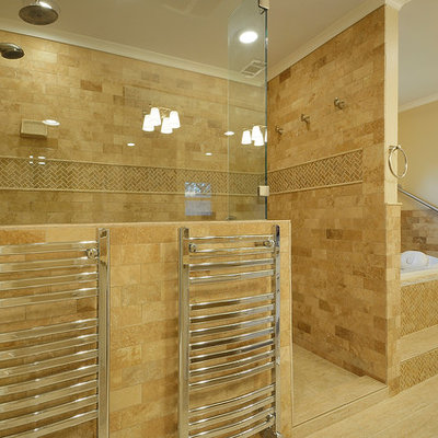 Elegant beige tile and subway tile alcove shower photo in Austin