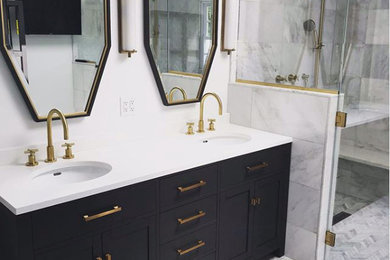 Example of an eclectic white tile and marble tile marble floor and white floor walk-in shower design in New York with recessed-panel cabinets, black cabinets, white walls, an undermount sink, quartz countertops and a hinged shower door