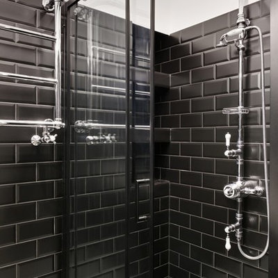 Inspiration for a small victorian master black tile and subway tile cement tile floor and multicolored floor bathroom remodel in London with glass-front cabinets, black cabinets, white walls, a console sink and white countertops