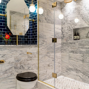 Design ideas for a large bohemian ensuite bathroom in London with an alcove bath, a one-piece toilet, grey tiles, marble tiles, grey walls, marble flooring, tiled worktops, grey floors, a hinged door, grey worktops and a walk-in shower.