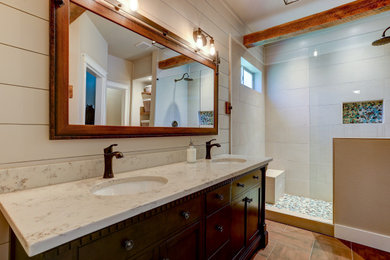 Bathroom - large craftsman master brown tile ceramic tile, gray floor, double-sink, exposed beam and wood wall bathroom idea in Other with dark wood cabinets, a one-piece toilet, brown walls, an undermount sink, white countertops and a freestanding vanity