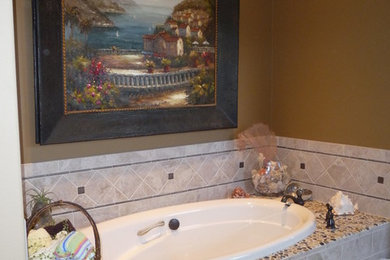 Large arts and crafts master gray tile and pebble tile alcove bathtub photo in Portland