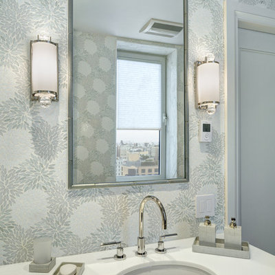 Corner shower - large transitional master gray tile, white tile and mosaic tile mosaic tile floor corner shower idea in New York with flat-panel cabinets, gray cabinets, a two-piece toilet, gray walls, an undermount sink and quartzite countertops