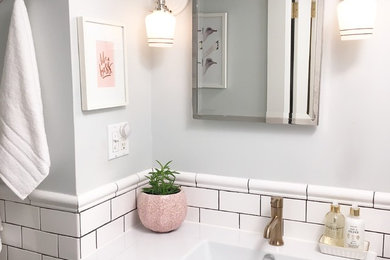 Inspiration for a small transitional master white tile and subway tile slate floor bathroom remodel in New York with a one-piece toilet, gray walls and a wall-mount sink