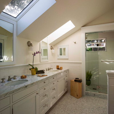 Example of a mid-sized classic master gray tile and subway tile mosaic tile floor alcove shower design in San Francisco with an undermount sink, shaker cabinets, white cabinets, marble countertops, white walls and a two-piece toilet