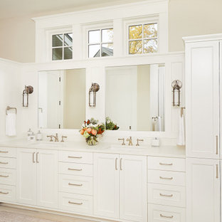 Inspiration for a timeless master ceramic tile, beige floor and double-sink bathroom remodel in Grand Rapids with shaker cabinets, white cabinets, beige walls, an undermount sink, quartz countertops, white countertops and a built-in vanity