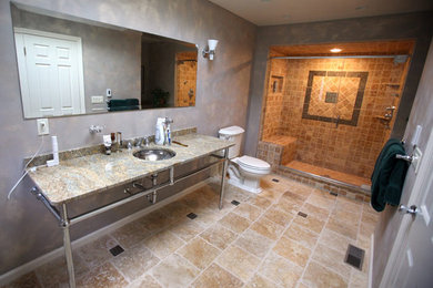 Inspiration for a mid-sized master brown tile and stone tile travertine floor alcove shower remodel in New York with an undermount sink, granite countertops, a two-piece toilet and multicolored walls