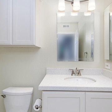 Hall Bathroom Renovation with White Vanity