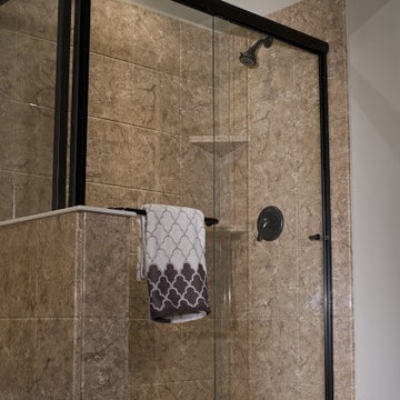 Oil-Rubbed Bronze Shower Frame with Stone Wall Panels