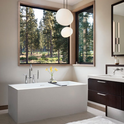 Large transitional master blue tile and subway tile porcelain tile freestanding bathtub photo in San Francisco with flat-panel cabinets, dark wood cabinets, a trough sink, a one-piece toilet, white walls and solid surface countertops