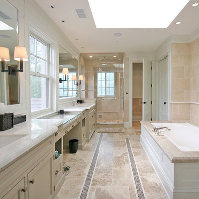 Large elegant master beige tile and limestone tile marble floor corner shower photo in Chicago with beige cabinets, recessed-panel cabinets, an undermount tub, beige walls, an undermount sink, marble countertops and gray countertops
