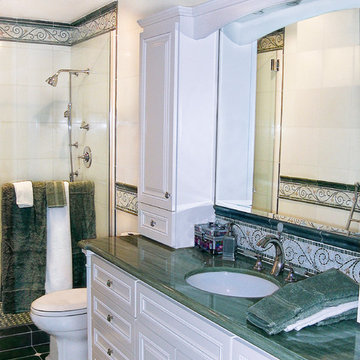 One of a Kind Designed Marble Bath with White Cabinets