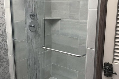 Inspiration for a transitional master gray tile and porcelain tile bathroom remodel in Seattle with gray walls