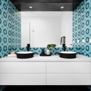 This is an example of a contemporary 3/4 bathroom in Melbourne with flat-panel cabinets, white cabinets, a vessel sink and white benchtops.