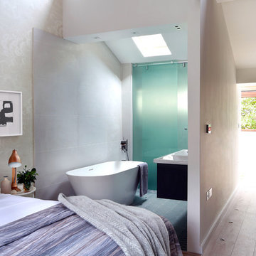 Open plan master bedroom suite with freestanding bath